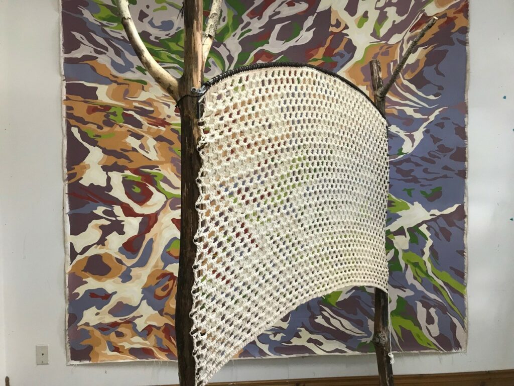 Prototype of the structure of the installation in front of a painting by Patricia Lortie