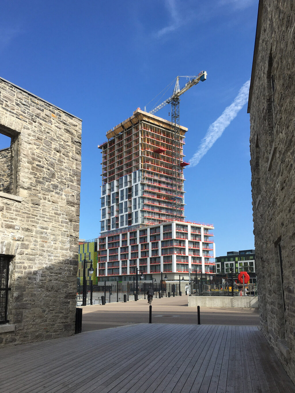 Ongoing construction on Chaudière island near the falls. Old stone mill ruins contrasting with new construction.